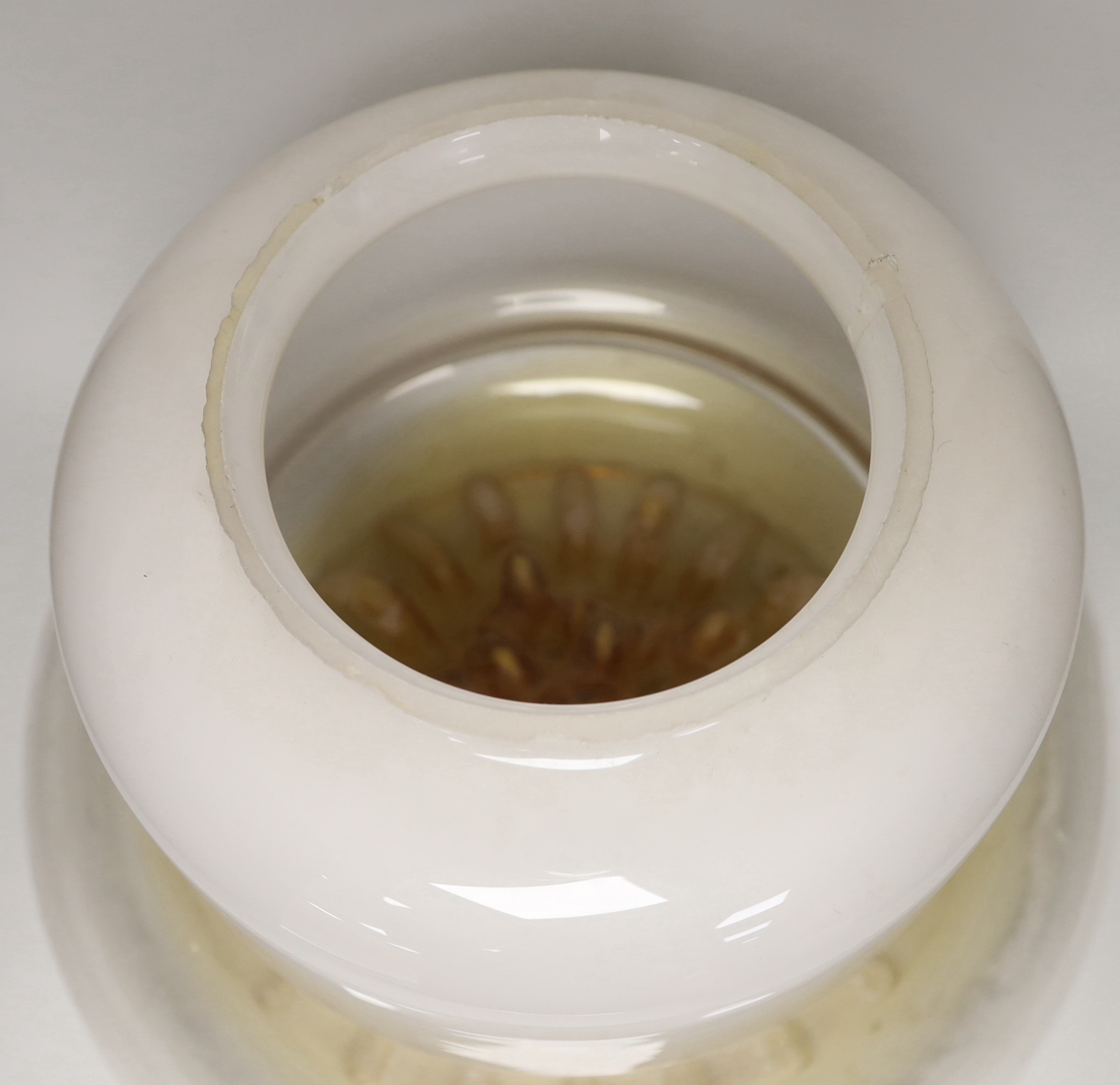 A large 1970's amber and opaque glass ceiling shade, 32cm high